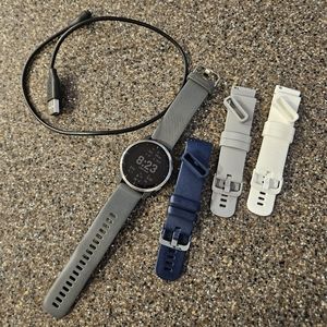 Garmin Vivoactive 4 watch with charger and replacement bands